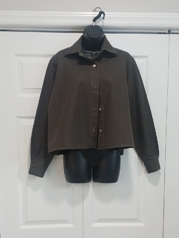 Boxy Olive Green Button-Front Shirt Jacket With Navy Blue Accent.